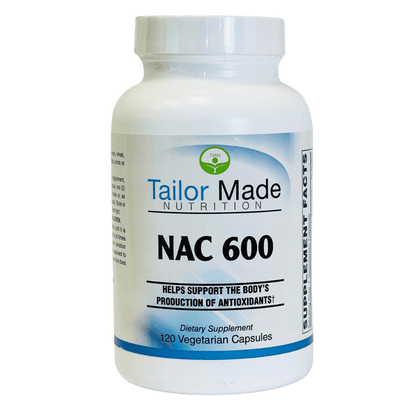 A bottle of Tailor Made Nutrition NAC 600 vegetarian capsules, which is a dietary supplement containing N-acetyl cysteine, selenium, and molybdenum.